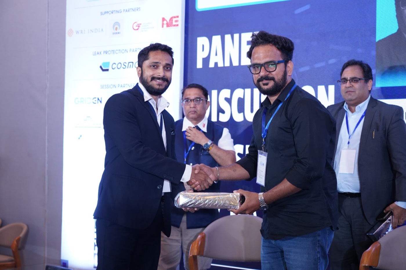 Battery technology team receiving recognition at an industry panel event